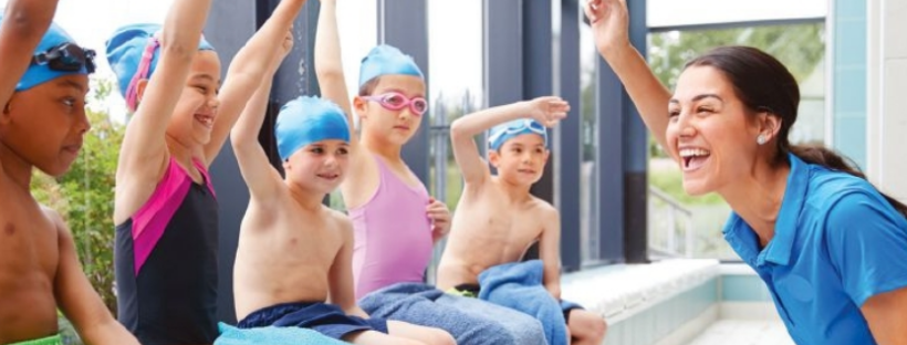 Swim teacher cheering kids on